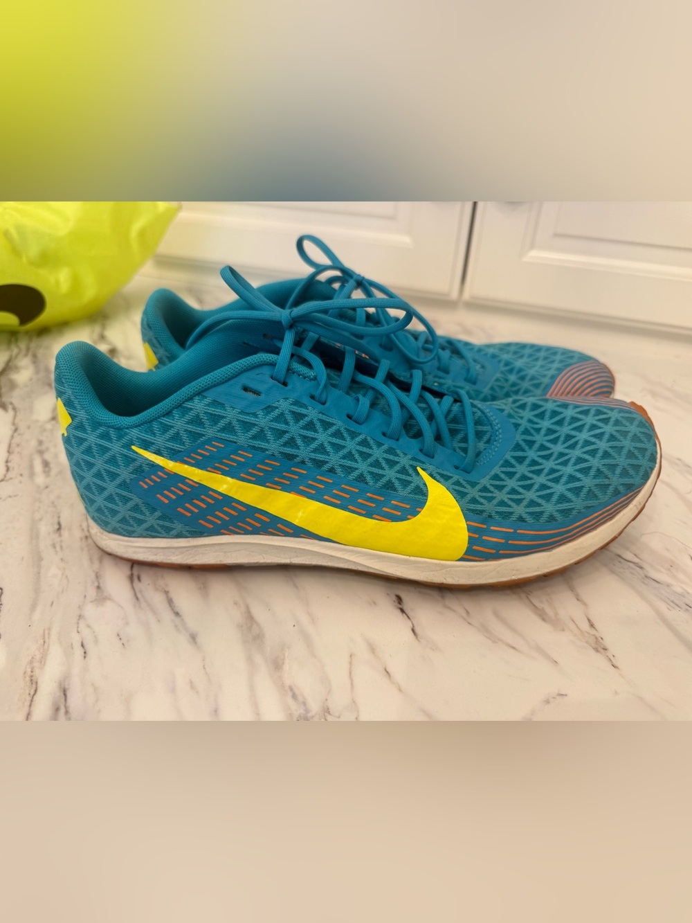 Nike Teal track shoes with Neon Yellow Swoosh